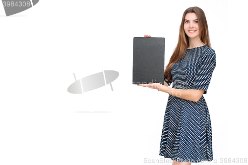 Image of Young smiling woman show blank card or paper