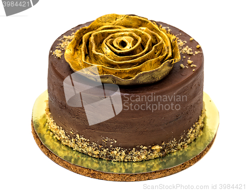 Image of Chocolate Cake Sprinkled with Crumbs and Golden Rose