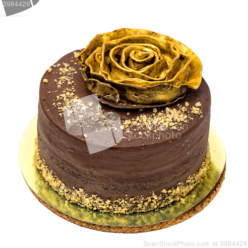 Image of Chocolate Cake Sprinkled with Crumbs and Golden Rose