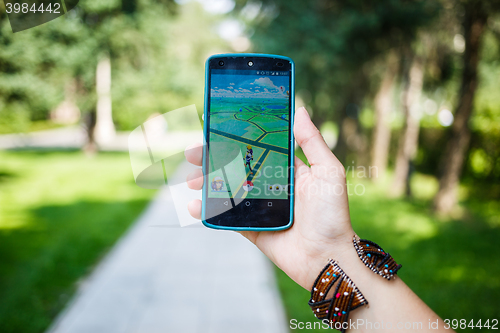 Image of Moscow, Russia - August, 02: Android user play in Pokemon Go augmented reality mobile game on smartphone.