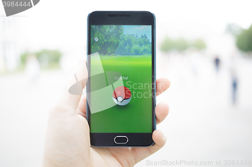 Image of Moscow, Russia - August, 02: Android user play in Pokemon Go augmented reality mobile game on smartphone.