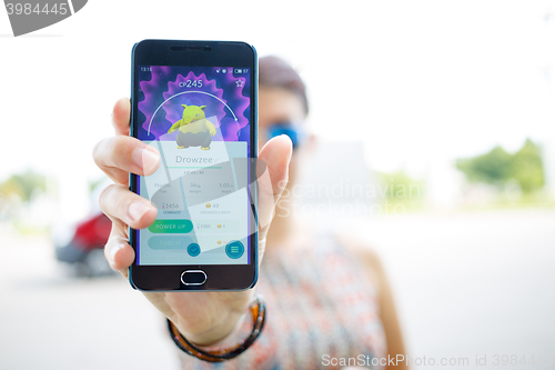 Image of Moscow, Russia - August, 02: Android user play in Pokemon Go augmented reality mobile game on smartphone.