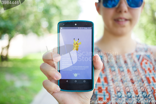 Image of Moscow, Russia - August, 02: Android user play in Pokemon Go augmented reality mobile game on smartphone.