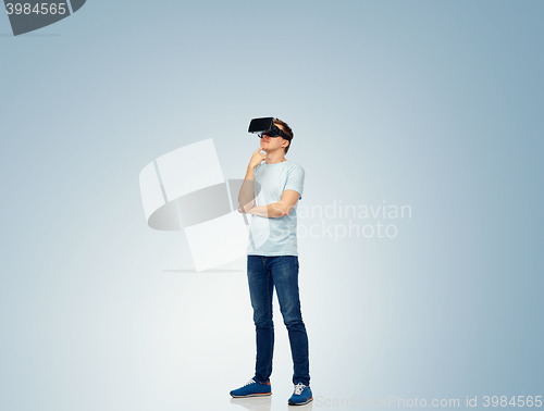 Image of happy man in virtual reality headset or 3d glasses