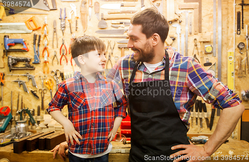 Image of happy father and little son workshop