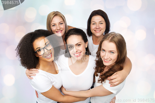 Image of group of happy different women in white t-shirts