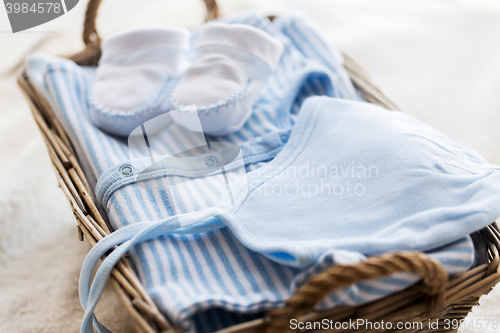 Image of close up of baby clothes for newborn boy in basket