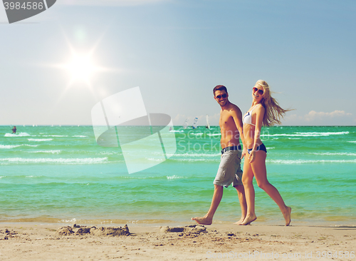 Image of couple walking on the beach