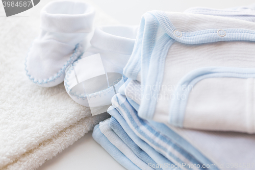 Image of close up of baby boys clothes for newborn on table