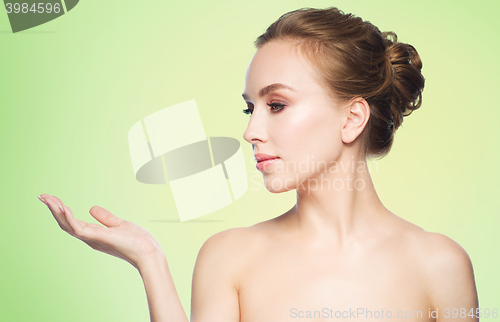 Image of smiling young woman face and shoulders