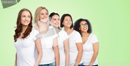 Image of group of happy different women in white t-shirts