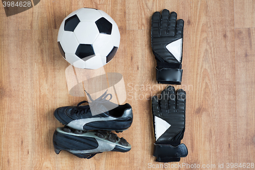 Image of close up of soccer ball, boots and gloves