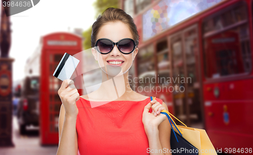 Image of woman with shopping bag in and credit card london 