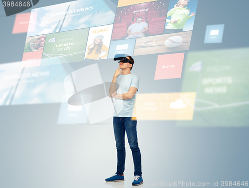 Image of happy man in virtual reality headset or 3d glasses