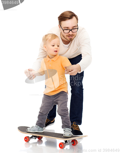 Image of happy father and little son on skateboard