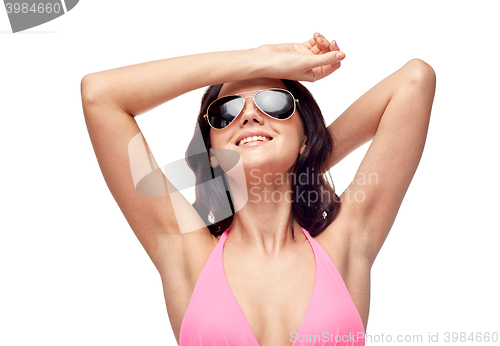 Image of happy woman in sunglasses and swimsuit