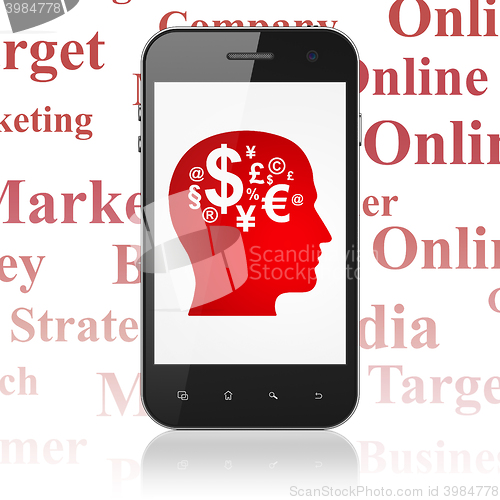 Image of Advertising concept: Smartphone with Head With Finance Symbol on display