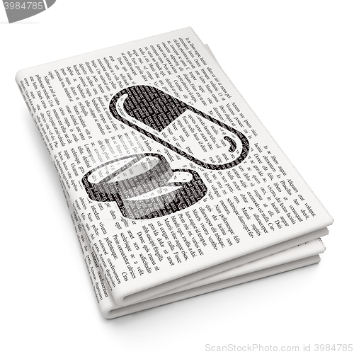 Image of Medicine concept: Pills on Newspaper background