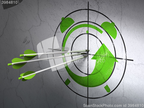 Image of Timeline concept: arrows in Alarm Clock target on wall background