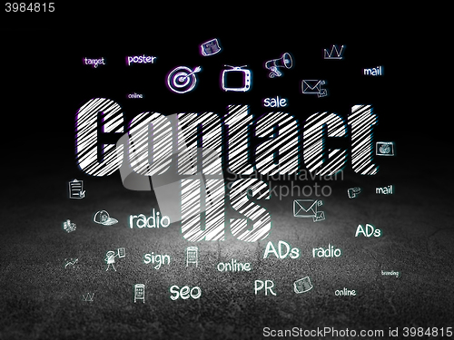Image of Advertising concept: Contact Us in grunge dark room