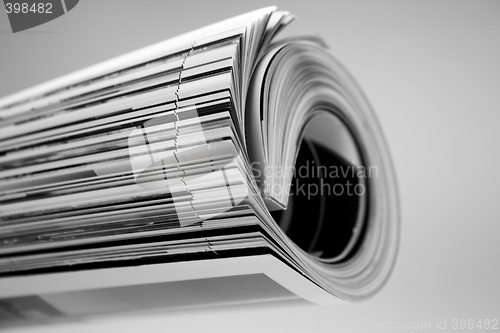 Image of rolled up magazine