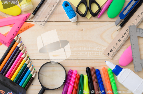 Image of School stationery on wooden board