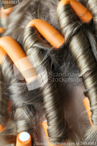 Image of curlers in her hair