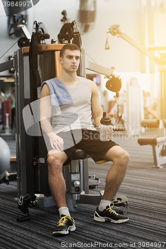 Image of man exercising on gym machine