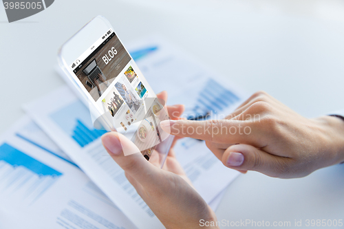 Image of close up of woman with transparent smartphone