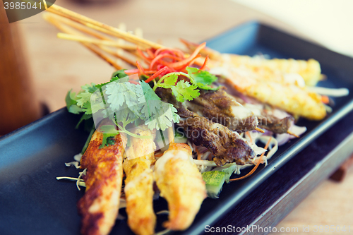 Image of close up of deep-fried asian snacks on plate