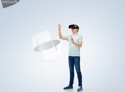 Image of happy man in virtual reality headset or 3d glasses