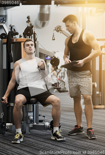Image of man exercising on gym machine