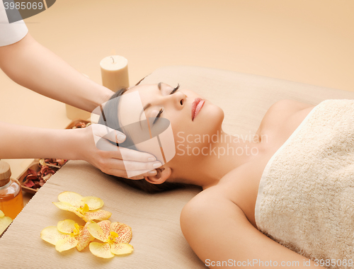 Image of beautiful woman in massage salon