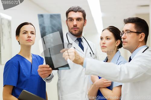 Image of group of medics with spine x-ray scan at hospital