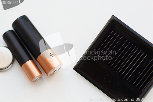 Image of close up of alkaline batteries and solar cell