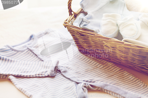 Image of close up of baby clothes for newborn boy in basket