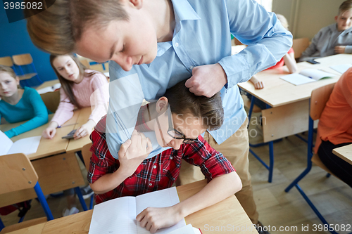 Image of student boy suffering of classmate mockery