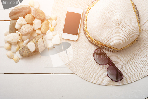 Image of beach accessories on wooden board