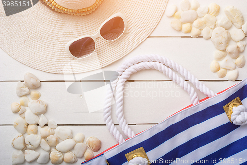 Image of beach accessories on wooden board