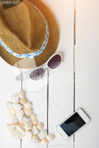 Image of beach accessories on wooden board