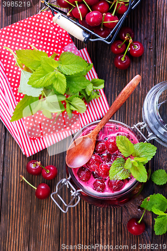 Image of cherry jam and berries