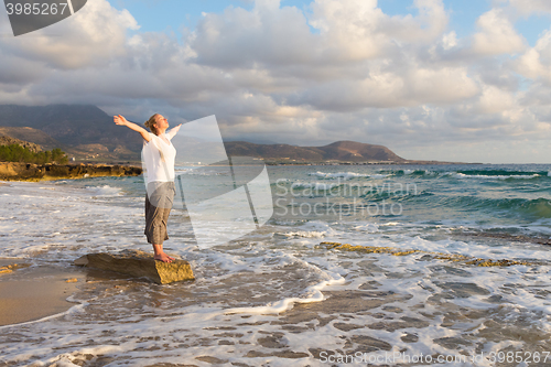 Image of Free Happy Woman Enjoying Sunset on Sandy Beach