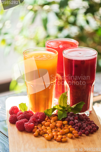 Image of fruit drink with cranberries raspberries and sea buckthorn