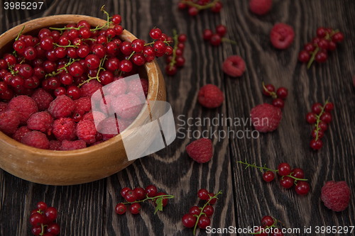 Image of Fresh berries on wooden table