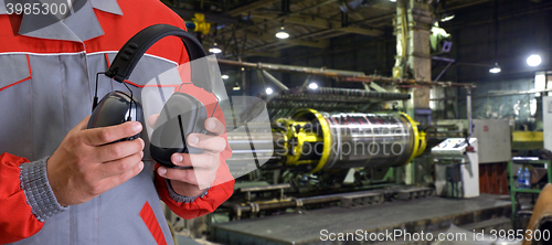 Image of Worker with protective headphone