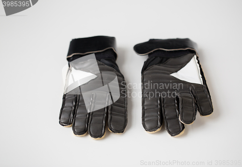 Image of close up of football or soccer goalkeeper gloves