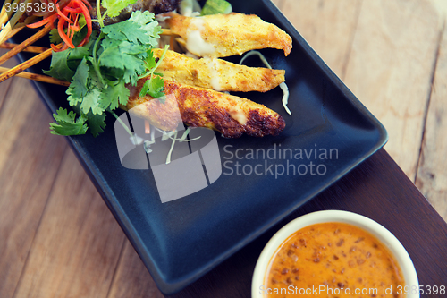 Image of close up of deep-fried asian snacks on plate