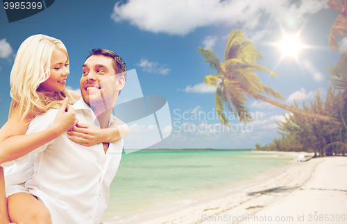 Image of happy couple having fun over summer beach