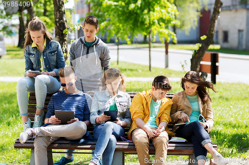 Image of group of students with tablet pc at school yard