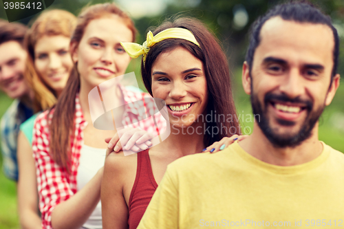 Image of group of smiling friends outdoors